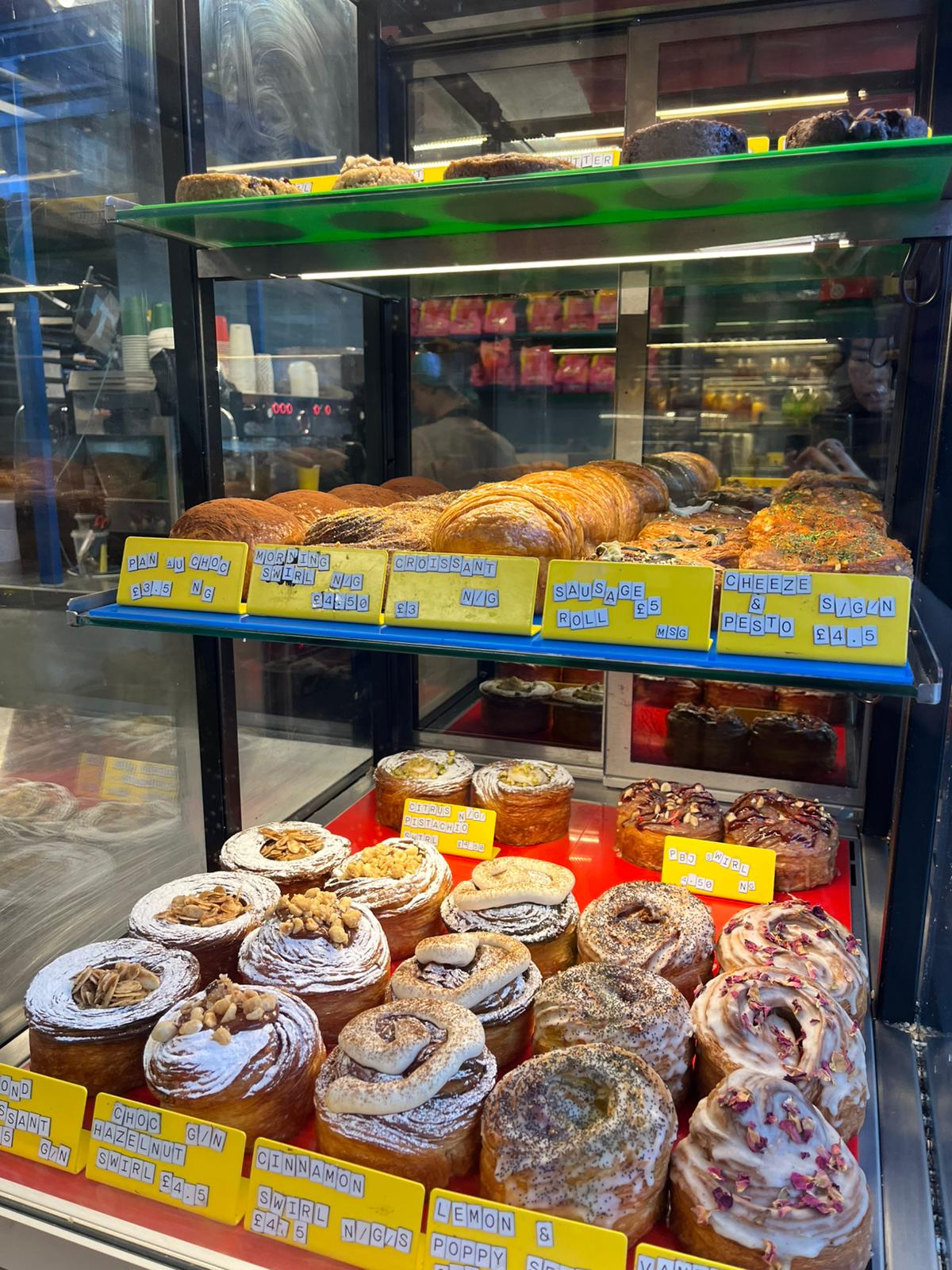 Okja bakery display with pastries and swirls